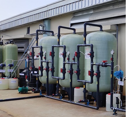 Industrial water treatment plant featuring a multi-tank filtration